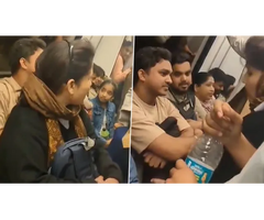 Viral Video of Women seated on a man’s lap Inside Delhi Metro